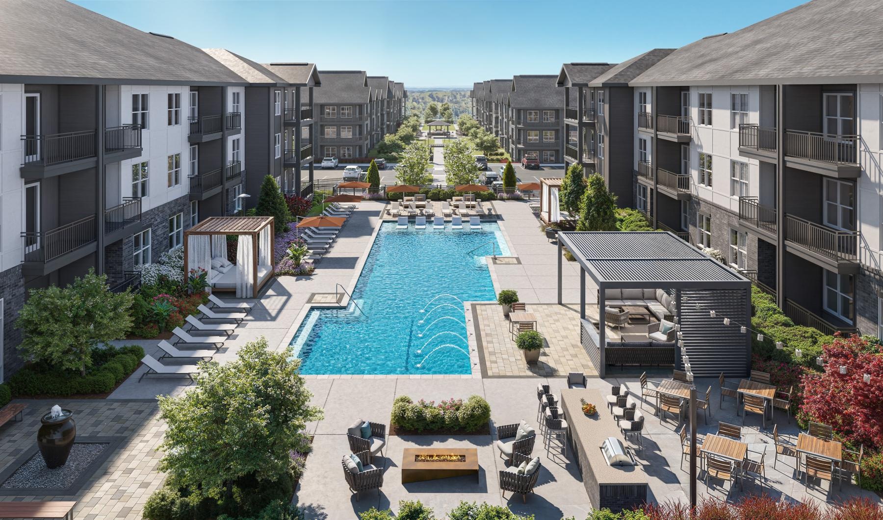 Aerial view of resort-style pool and buildings at The Parker apartments in Acworth, GA